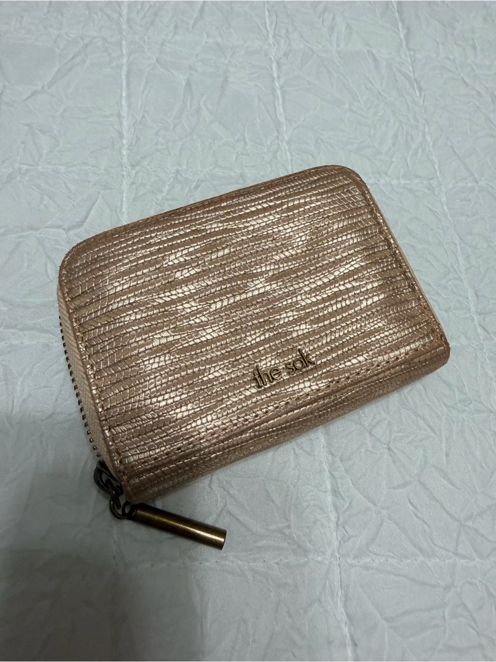 The Sak Metallic Rose Gold Compact Zip Wallet